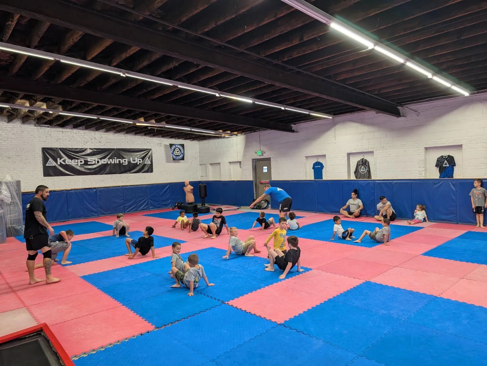 Children martial arts class on mat