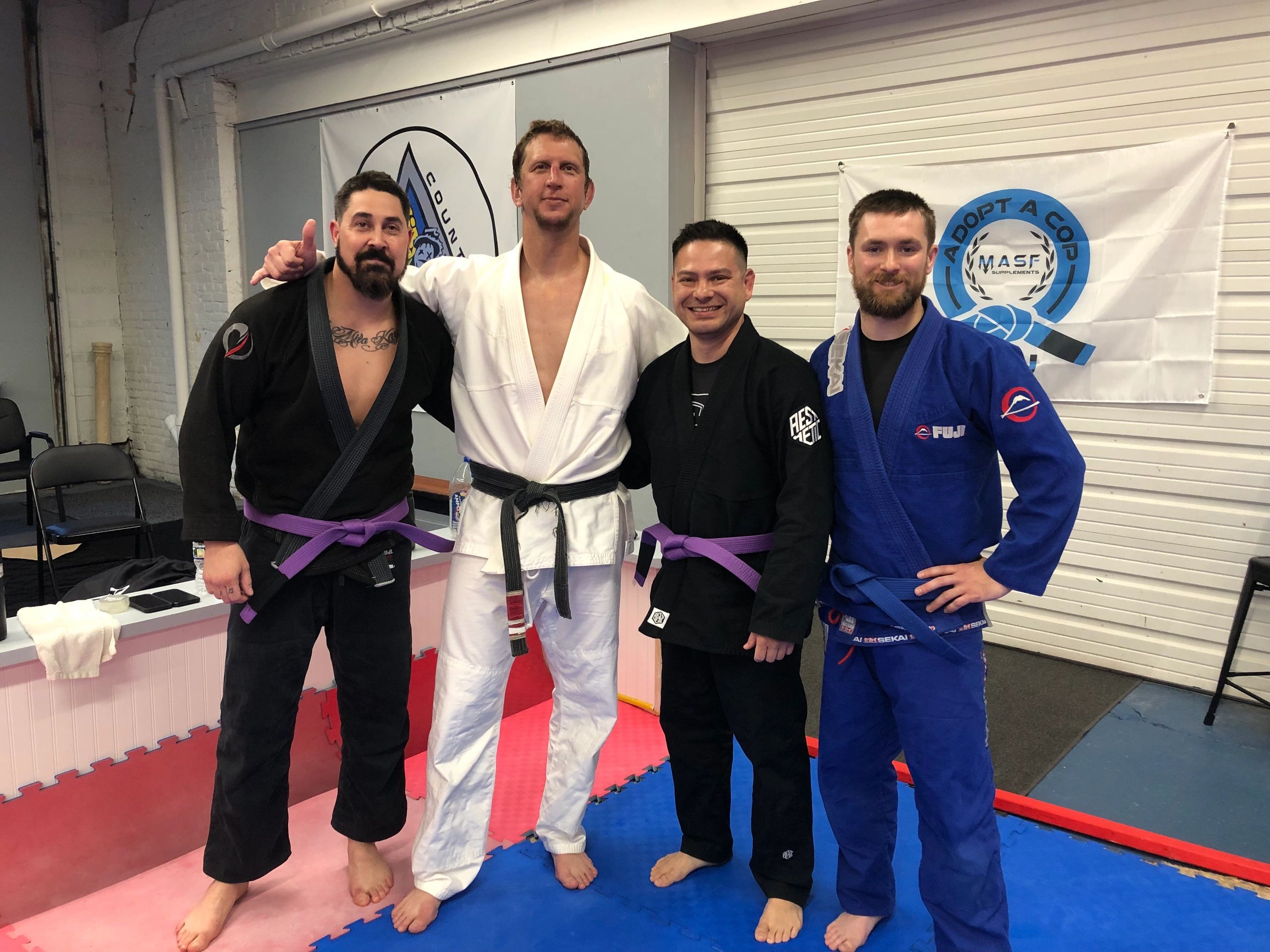 Four martial artists gis