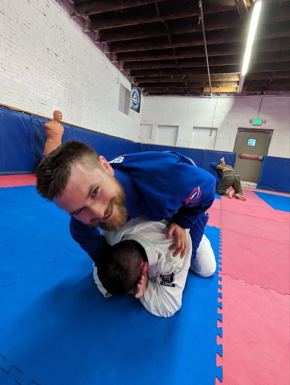 Instructor blue gi teaching